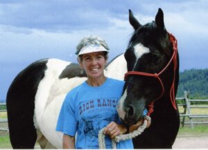 Happy guest and her horse